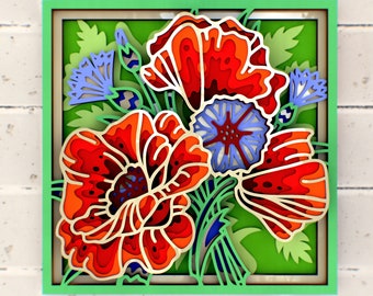 May include: A paper cut-out art piece featuring a bouquet of red poppies and blue flowers. The flowers are layered and detailed, creating a 3D effect. The background is a green leafy pattern.