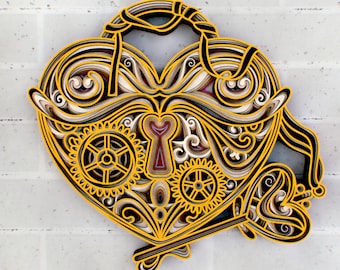 May include: A yellow and black paper cut-out of a heart-shaped padlock with intricate details, including gears and a keyhole. The padlock is decorated with swirls and floral patterns.