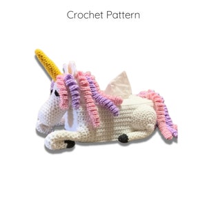 May include: A white crocheted unicorn tissue box cover with a yellow horn, pink and purple mane, and a white tissue peeking out of the back.