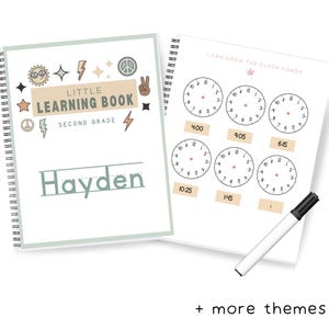 May include: A green and beige learning book with a title that says "Little Learning Book" and "Second Grade". The book has a personalized name that says "Hayden". The cover has a variety of colorful illustrations including a peace sign, a sun, and a lightning bolt. The book is open to a page with a title that says "I Can Draw The Clock Hands". The page has several clock faces with the time written below each clock. A black marker is lying on the page.