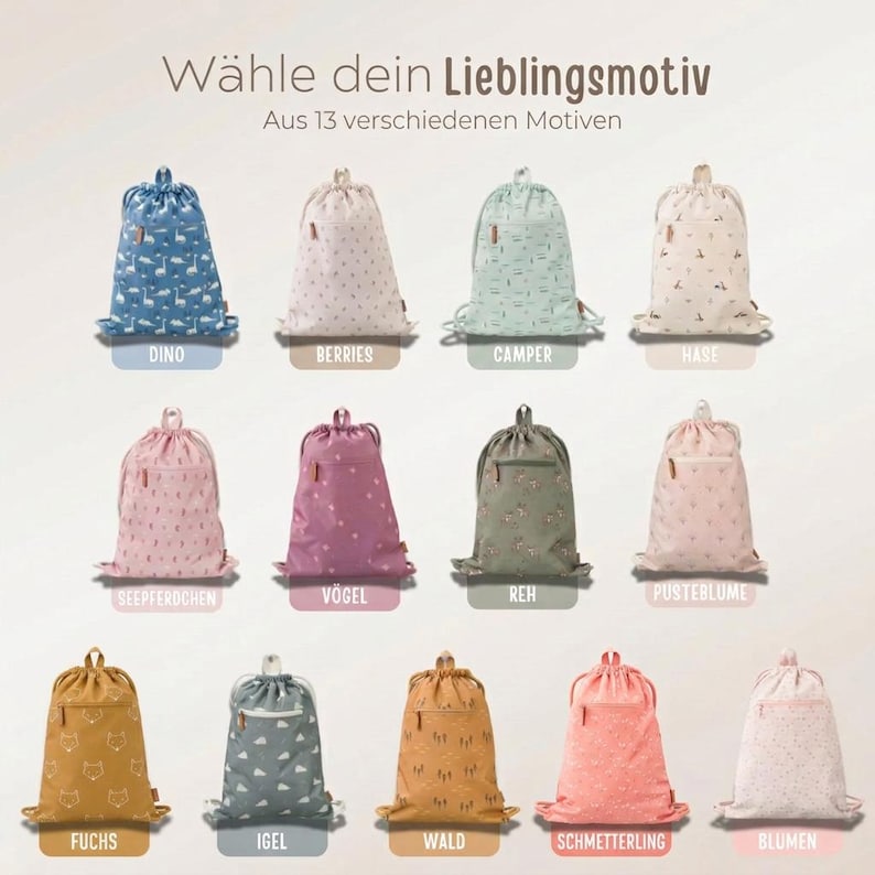 May include: Collection of drawstring backpacks in various colors and patterns, including dinosaurs, berries, and floral designs. Each bag has a drawstring closure and a small zippered pocket. Text at the top reads "W&auml;hle dein Lieblingsmotiv" and "Aus 13 verschiedenen Motiven."
