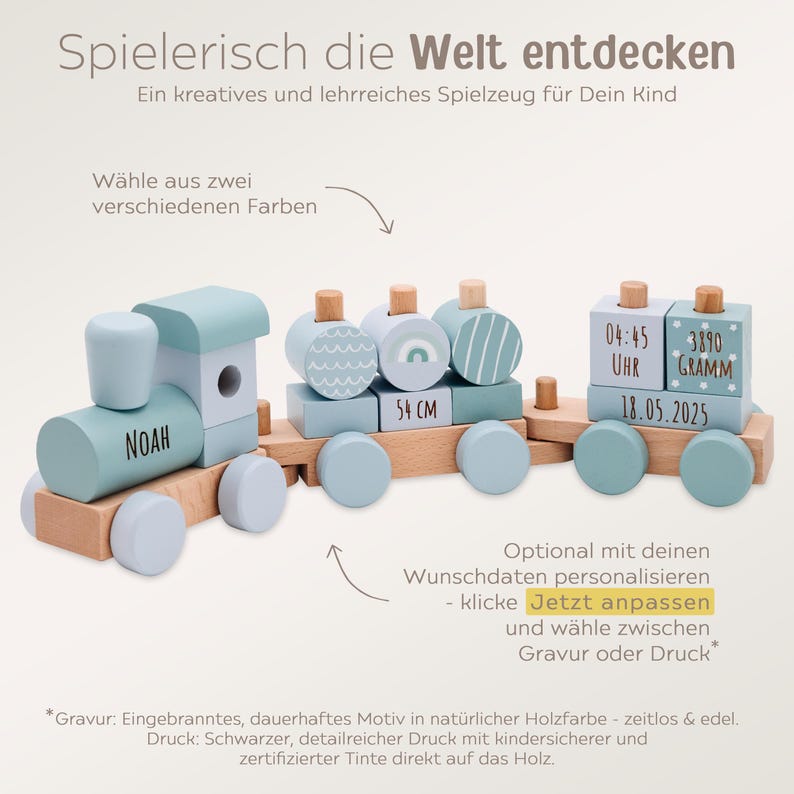 May include: Wooden toy train in light blue and natural wood tones. The train features the name "NOAH" on the engine, decorative carriages, and a measurement of 54 cm. Includes text and numbers.
