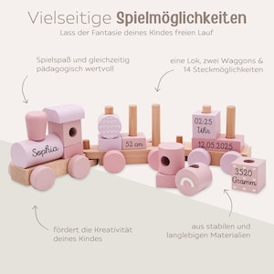 May include: A wooden toy train set in shades of pink and natural wood. The train features the name "Sophia", and includes a locomotive, two wagons, and various stacking blocks. The set is 52 cm long and weighs 3520 grams.