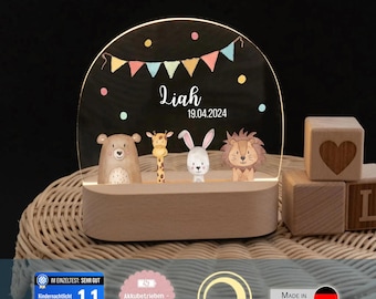 May include: An arched acrylic night light with a wooden base, featuring a printed design of a bear, giraffe, rabbit, and lion under a colourful bunting banner. The text reads Liah and 19.04.2024. The light is illuminated and stands upright.