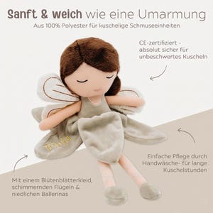 May include: A soft, plush doll in the shape of a fairy, with brown hair and closed eyes. The doll wears a light green dress and has matching wings. The text on the doll says "Finja". The doll is made of 100% polyester.