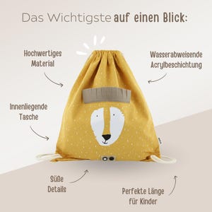 May include: A yellow drawstring bag with a cute fox face design. The bag has a small inner pocket and is made of water-resistant material. The bag is perfect for kids.
