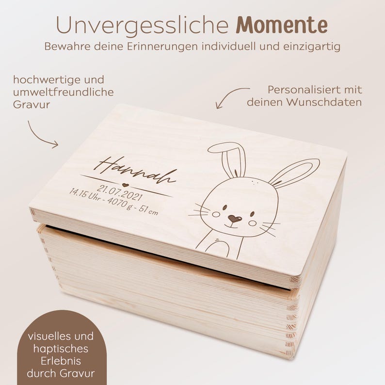 May include: A wooden keepsake box with a bunny rabbit design and the text "Hannah 21.07.2021 14.15 Uhr - 4070g - 51cm" engraved on the lid. The box is personalized with the name and birth details of the child.