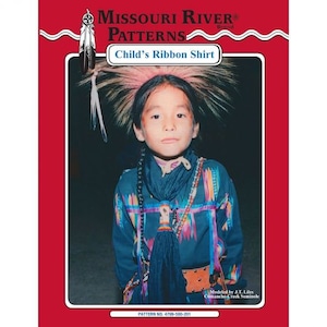 May include: A product image featuring a child wearing a Child's Ribbon Shirt. The shirt is dark blue with colorful ribbon accents. The image is framed by a red border with the text "MISSOURI RIVER PATTERNS" and "Child's Ribbon Shirt".
