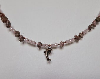 Necklace beaded with stones and dolphin charm