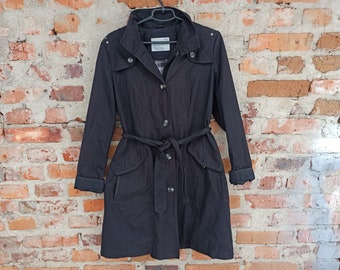 May include: A black trench coat with a belt and a hood. The coat has a button closure and two pockets.