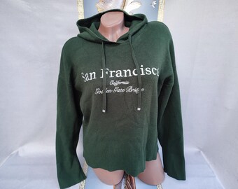 90s Women's Green Hooded Pullover. Sizes M-L.