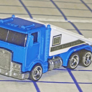 Hot Wheels Diecast Cabover Ramp Truck Fischer Motors Limited 1986 Tow Truck