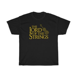 May include: Black t-shirt with the text "THE LORD OF THE STRINGS" in gold lettering. A gold violin graphic is to the right of the text. The shirt is made of a soft, comfortable material.