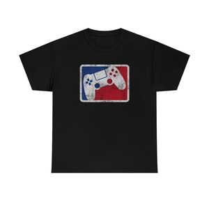 May include: Black t-shirt with a vintage-style graphic of a video game controller in a red, white, and blue logo.