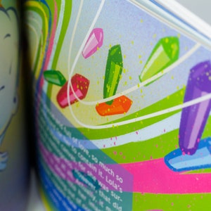 May include: A colorful illustration of a book with a blue and yellow cloud on the left page and a green, pink, and purple abstract design on the right page. The text on the right page reads "of love, so much so to contain it. Lola's for she was sur- ever, that did".