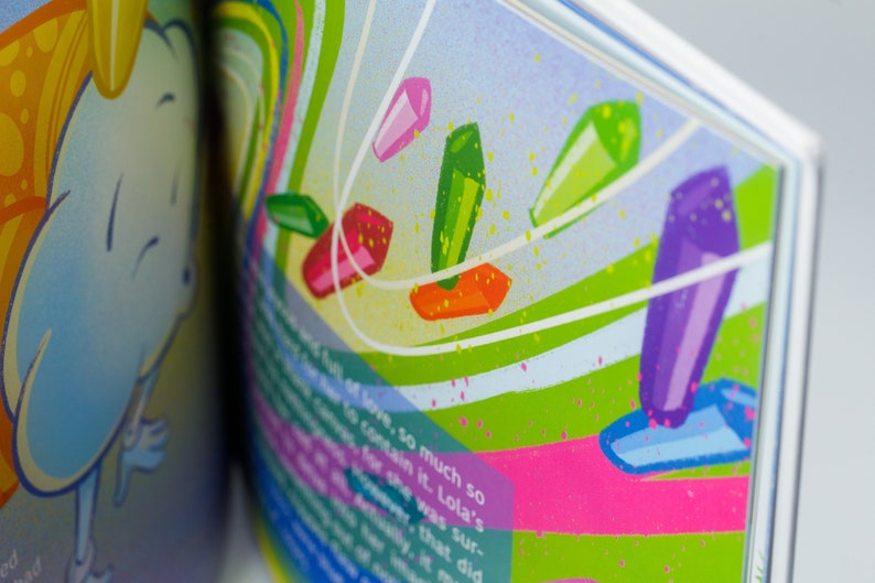 May include: A colorful illustration of a book with a blue and yellow cloud on the left page and a green, pink, and purple abstract design on the right page. The text on the right page reads "of love, so much so to contain it. Lola's for she was sur- ever, that did".