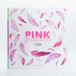 May include: A book cover with the title "PINK feathers" in pink letters. The background is white with pink watercolour feathers scattered across the page. The book is by Brenda Ramirez and features the logo "aiko" in green and blue.