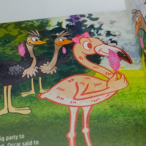 May include: A pink flamingo with a pink feather in its beak stands on a green grassy background. Two ostriches with black and brown feathers stand behind the flamingo.