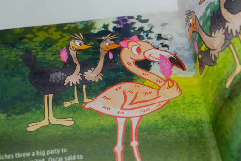 May include: A pink flamingo with a pink feather in its beak stands on a green grassy background. Two ostriches with black and brown feathers stand behind the flamingo.