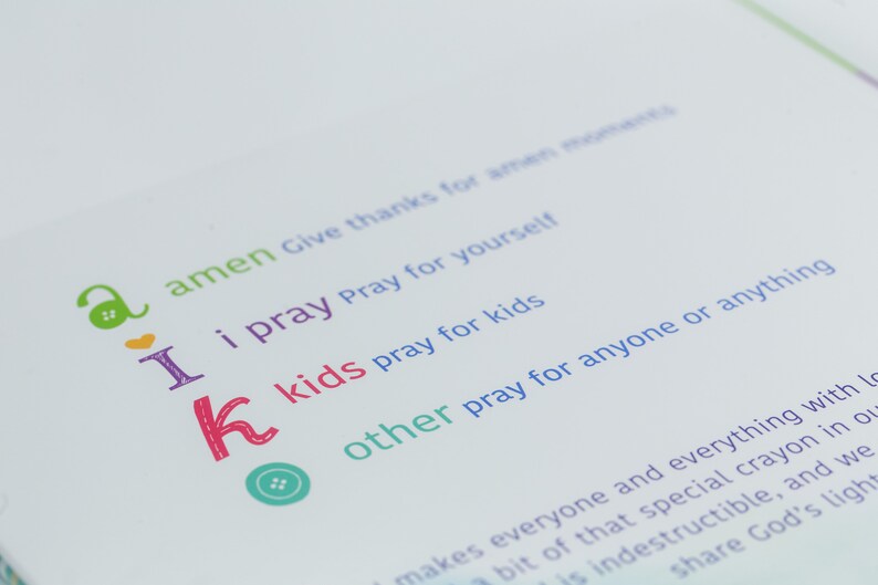 May include: A page from a children's book with colorful letters and illustrations. The text reads "amen Give thanks for amen moments I i pray Pray for yourself k kids pray for kids other pray for anyone or anything"