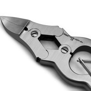 May include: Close-up of a silver surgical tool with a curved blade and a handle with a diamond-shaped pattern. The tool is labelled "MediTools.com.au CE".