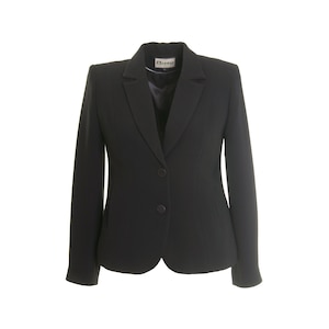 May include: A black blazer with a notched lapel and a two-button fastening. The blazer features long sleeves and a tailored cut. The brand name "Busy" is visible on the label. This classic jacket is suitable for professional or formal wear.