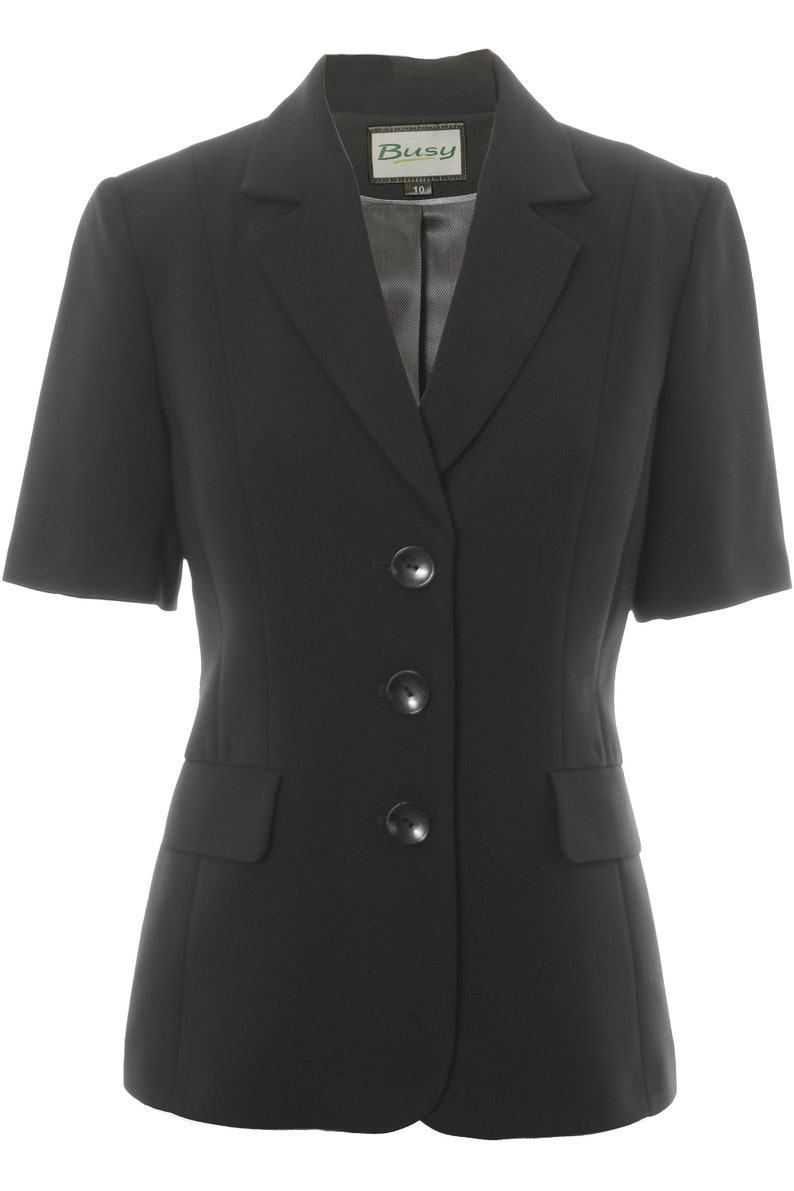 May include: A black short-sleeved blazer with a notched collar and three buttons. The blazer has a label that says "Busy 10".