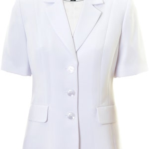 May include: A white short-sleeved blazer with a single button closure and two pockets. The blazer has a label that says "Busy" on it.