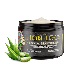May include: A black jar of Lion Locs Locking Moisturizer with a white cream top. The label features a lion illustration, the text "Lion Locs Locking Moisturizer," and "Original Made in the USA - 8 oz (226 g)." Fresh green aloe vera leaves sit beside the jar.