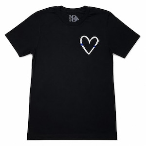 May include: A black short-sleeved t-shirt featuring a white hand-drawn heart outline on the left chest. The heart design includes a thin horizontal blue stripe accent. The inner neck label displays the text FLOOR 9 with a rose graphic.