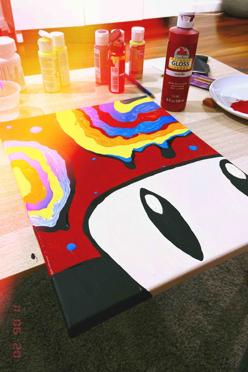 May include: A colorful abstract painting on a canvas with a white background and black outlines. The painting features a rainbow of colors, including red, orange, yellow, green, blue, indigo, and violet. The painting is titled "#11.08.20".