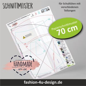 Könnte beinhalten: Ein Papierschnittmuster für eine 70 cm Schultüte mit gedruckten Diagrammen, gestrichelten Schnittlinien und Anleitungstext. Der Bogen enthält Beschriftungen wie SCHNITTMUSTER, CUT & SEW sowie eine rosa Grafik mit dem Text HANDMADE WITH LOVE.