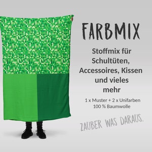 Könnte beinhalten: Grüner Stoff mit einem Pixelmuster, einem einfarbigen grünen Abschnitt und dem Text "FARBMIX Stoffmix für Schultüten, Accessoires, Kissen und vieles mehr 1 x Muster + 2 x Unifarben 100% Baumwolle ZAUBER WAS DARAUS."