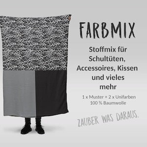 Könnte beinhalten: Ein schwarzer und weißer Stoff mit einem gecrackten Muster, ein grauer Stoff und ein schwarzer Stoff. Der Text "FARBMIX" ist in Schwarz und Weiß. Der Text "Stoffmix für Schultüten, Accessoires, Kissen und vieles mehr" ist in Schwarz. Der Text "1 x Muster + 2 x Unifarben 100% Baumwolle" ist in Schwarz. Der Text "ZAUBER WAS DARAUS." ist in Schwarz und Weiß.