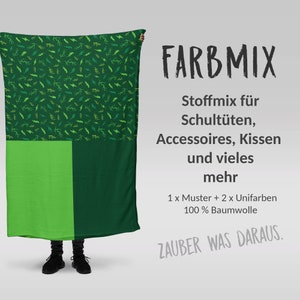 Könnte beinhalten: Ein grüner Stoff mit einem Blitz-Muster. Der Text "FARBMIX" befindet sich in der oberen rechten Ecke. Der Text "Stoffmix für Schultüten, Accessoires, Kissen und vieles mehr" befindet sich unter dem Titel. Der Text "1 x Muster + 2 x Unifarben 100% Baumwolle" befindet sich unter der Beschreibung. Der Text "ZAUBER WAS DARAUS." befindet sich in der unteren rechten Ecke.