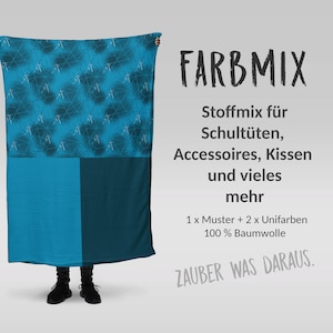 Könnte beinhalten: Ein blauer und schwarzer Stoff mit einem geometrischen Muster. Der Text "FARBMIX" ist in schwarzen Buchstaben. Der Text "Stoffmix für Schultüten, Accessoires, Kissen und vieles mehr" ist in schwarzen Buchstaben. Der Text "1 x Muster + 2 x Unifarben 100% Baumwolle" ist in schwarzen Buchstaben. Der Text "ZAUBER WAS DARAUS." ist in grauen Buchstaben.