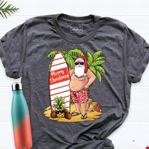 Christmas Santa Surf Shirt, Beach Christmas Shirt, Christmas Shirt, Hawaiian Christmas tee,  Santa Beach Shirt, Tropical Christmas Beach Tee