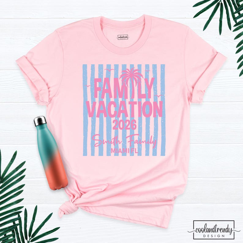 May include: A light pink t-shirt featuring a graphic with vertical light blue stripes, a palm tree silhouette, and the text "FAMILY VACATION 2026", "Smith Family", and "MIAMI FL". A teal and orange gradient water bottle is positioned to the left.