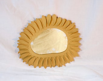 Petal mirror with gold tan