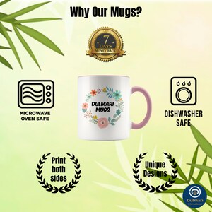 May include: White ceramic mug with a pink rim and handle. The mug features a floral design with the text "Dulmari Mugs". The mug is microwave and dishwasher safe. The image also includes icons indicating that the mug is microwave and dishwasher safe, as well as a text overlay that says "Print both sides" and "Unique Designs".