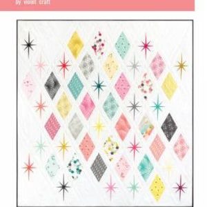 May include: A quilt pattern design featuring a white background with a repeating pattern of colorful diamond shapes and starburst designs. The text "the Atomic Starburst quilt" and "by violet craft" is at the top of the design. The hashtag #atomicstarburst and the number 020 are at the bottom of the design.