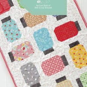 May include: A table runner quilting pattern featuring a design of mason jars with various fabric patterns. The pattern is titled "Yes You Can!" and is by "Last Bolt of Bee in my Bonnet". The finished size is 17" x 57".
