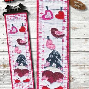 May include: A quilting pattern for a gnome holding a heart with a love bird hanging above. The pattern is called "Gnome in Love" and is 6 inches by 22 inches. The skill level is easy.