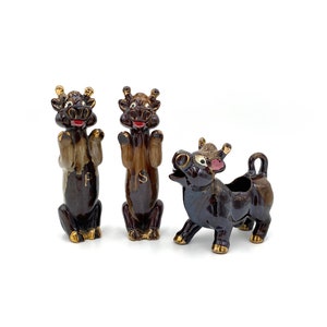 Vintage Cow Salt And Pepper Shakers And Creamer Brown Fine Ceramic Japan Damage Please read.