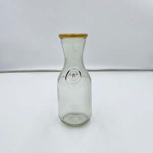 Vintage Milk Jar Glass carafe with unique indented bottom.