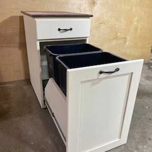 Double pull out trash can cabinet