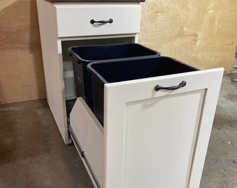 Double pull out trash can cabinet