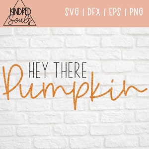 May include: A white brick wall background with the text "Hey There Pumpkin" in black and orange lettering. The word "Pumpkin" is in a cursive font and is orange.