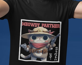 Peut inclure: T-shirt noir avec un chat de dessin animé vêtu en cow-boy, tenant deux pistolets. Le chat porte un chapeau, un bandana rouge et une ceinture. Le texte "MEOWDY PARTNER" est au-dessus du chat.