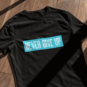 Never Give Up T-Shirt: Unisex Heavy Cotton Tee